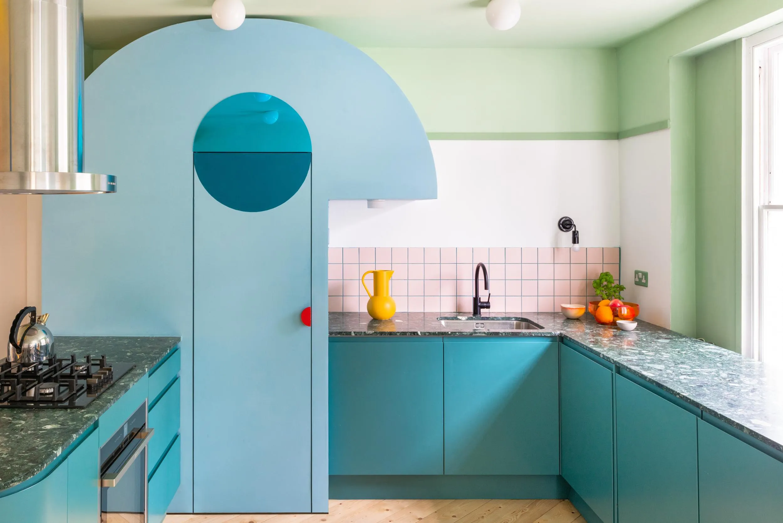 Photo of the cooking area in the kitchen, showing blue cabinetry. By Office S&M, RIBA Chartered Architectural Practice in London.