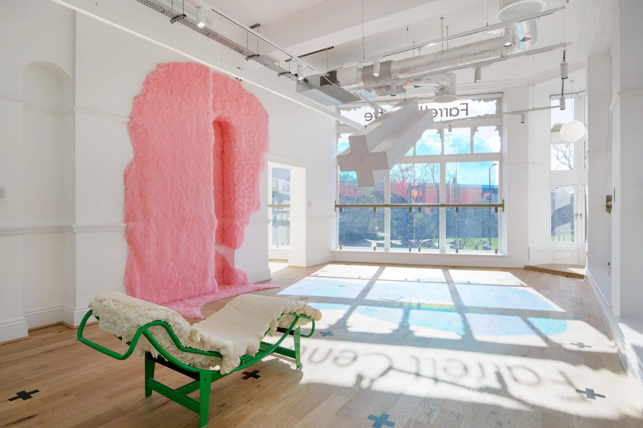 Internal photo of the exhibition, with big windows in the background.By Office S&M, RIBA Chartered Architectural Practice in London.