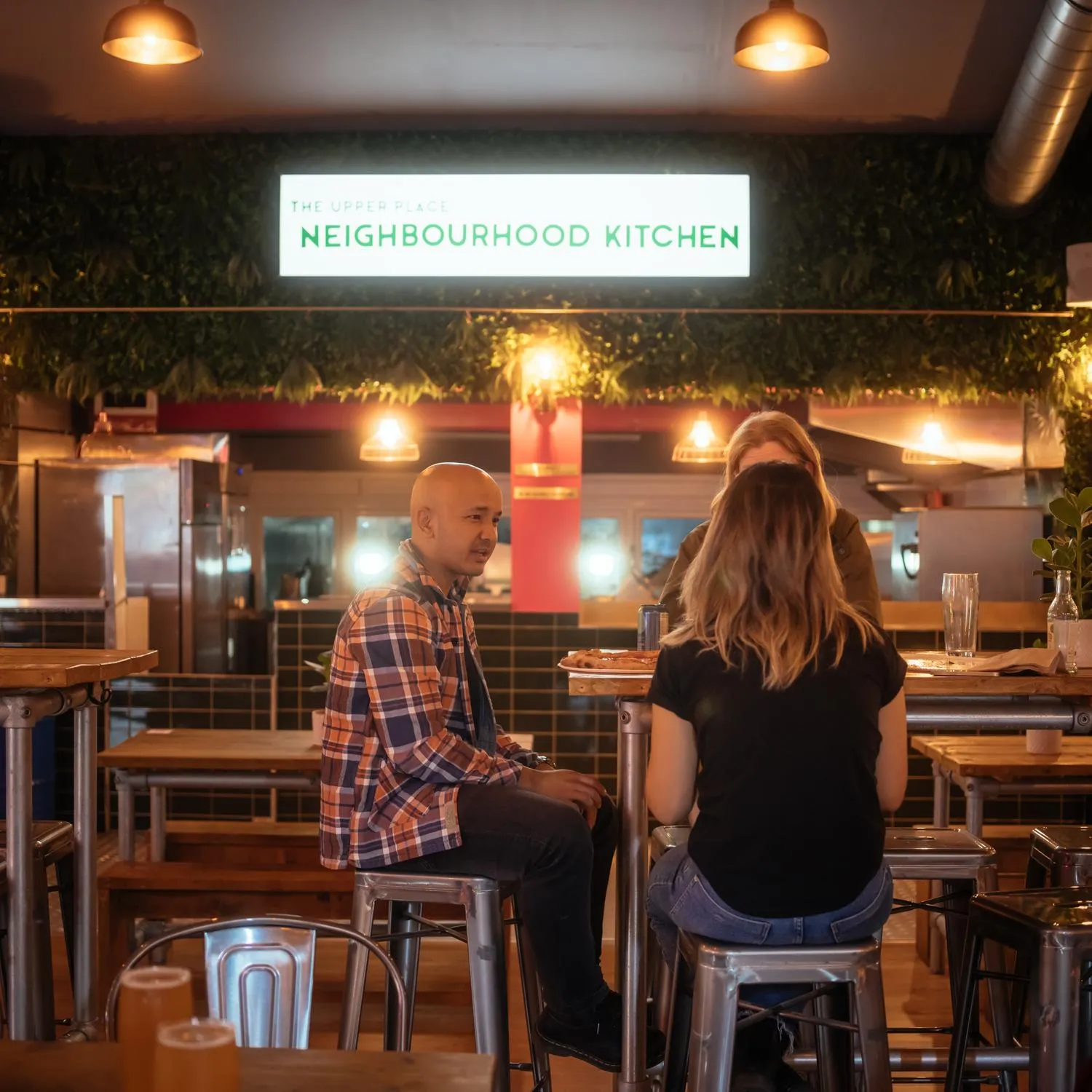 Photo of a group of people chatting. By Office S&M, RIBA Chartered Architectural Practice in London.