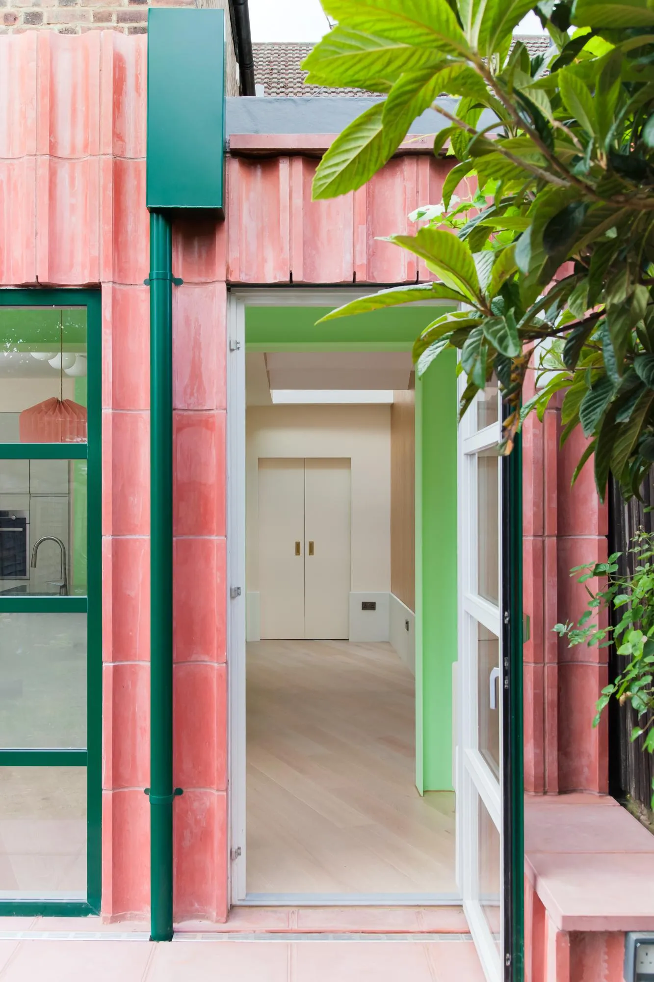 Photo of the kitchen doors as seen from the garden. By Office S&M, RIBA Chartered Architectural Practice in London.