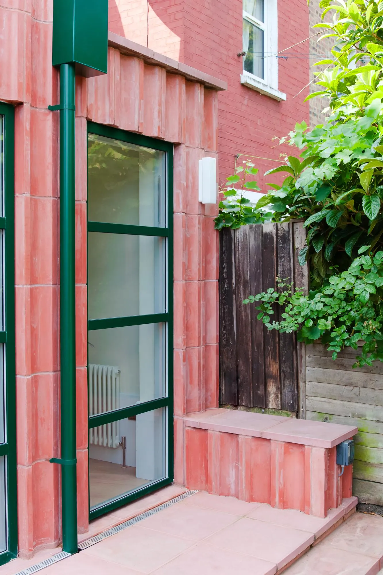 Detail photo of the kitchen door and the threshold. By Office S&M, RIBA Chartered Architectural Practice in London.