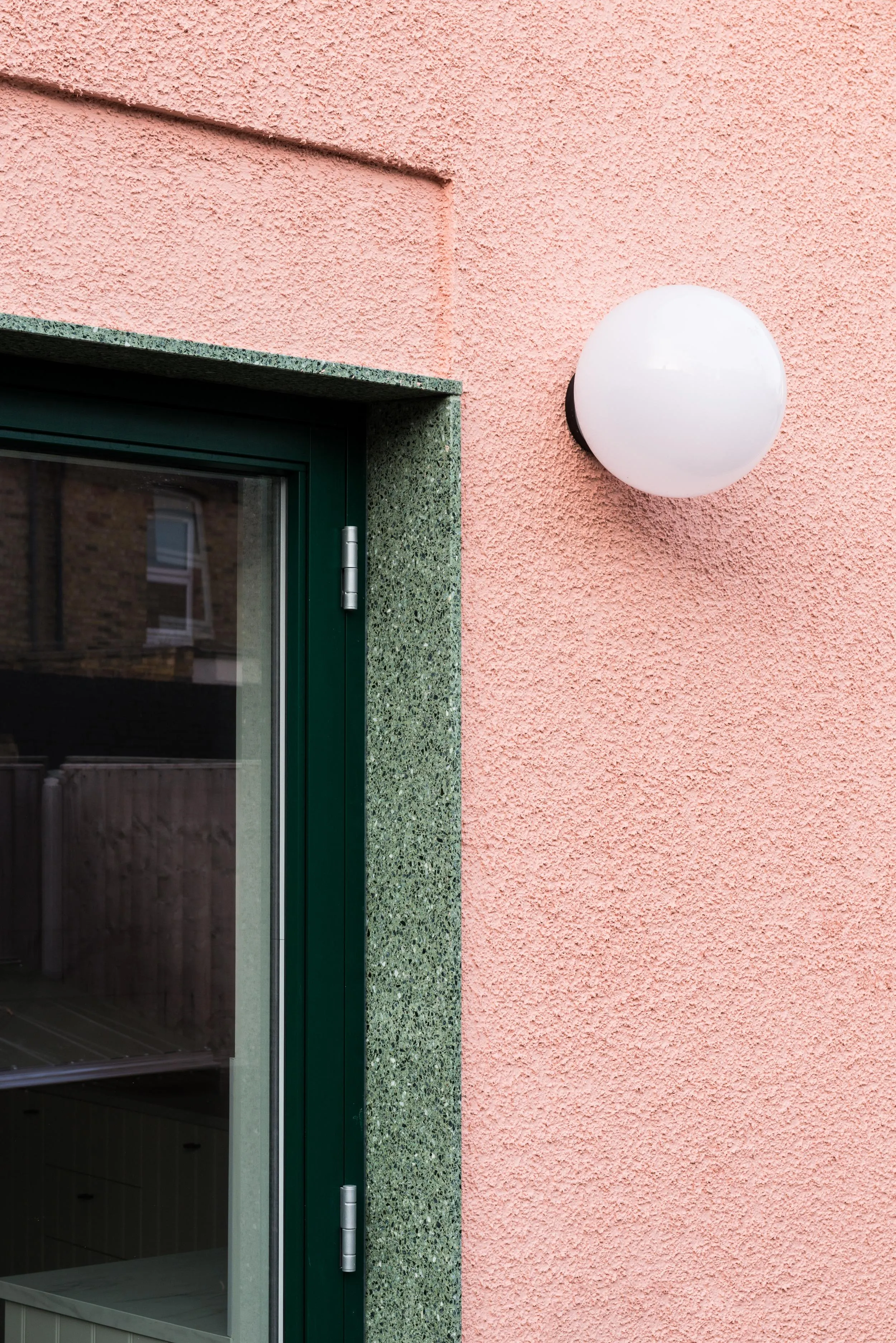 Zoomed in detail photo showing the lamp and doorway details. By Office S&M, RIBA Chartered Architectural Practice in London.