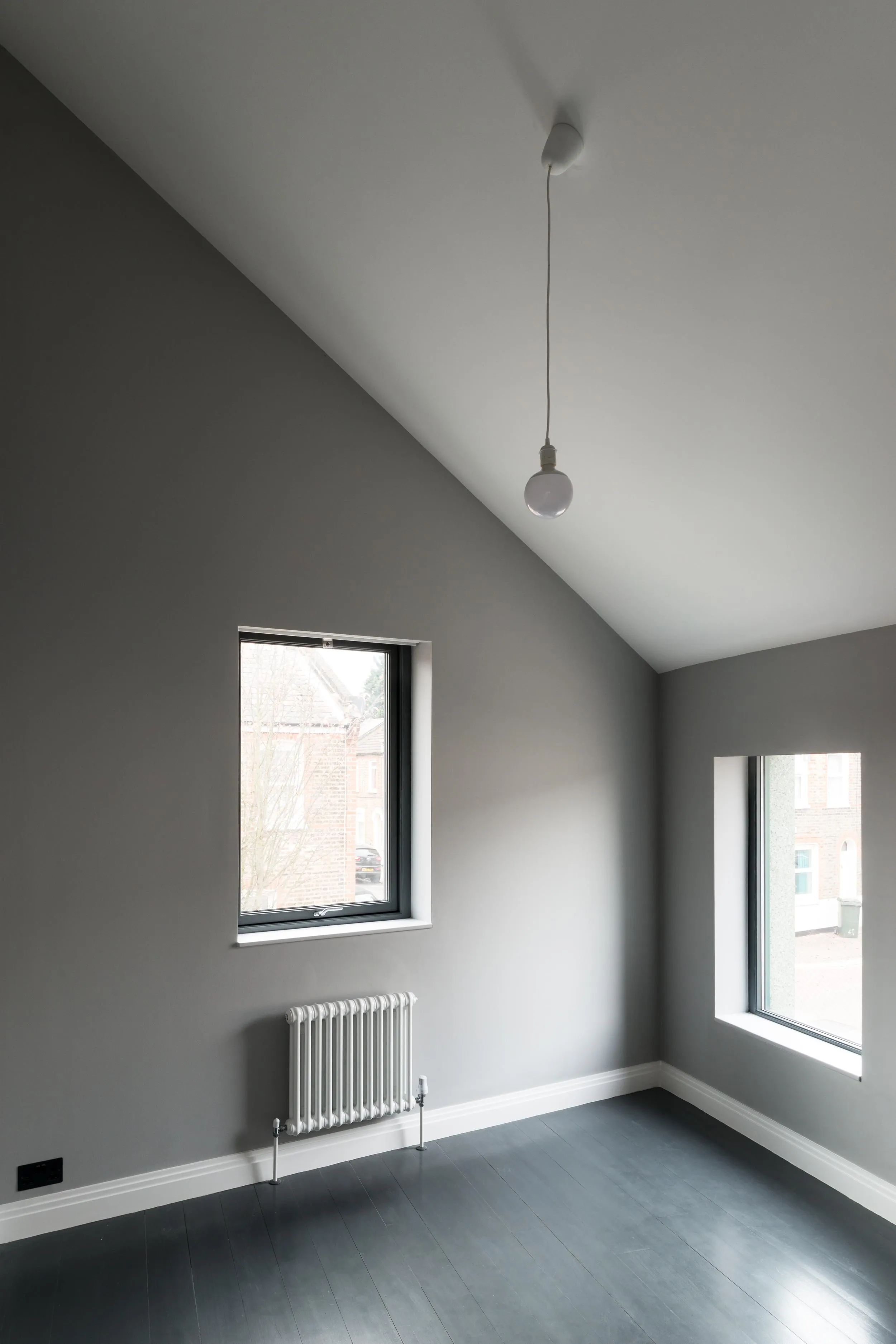 Photo of the upper floor room, with a roof angle. By Office S&M, RIBA Chartered Architectural Practice in London.