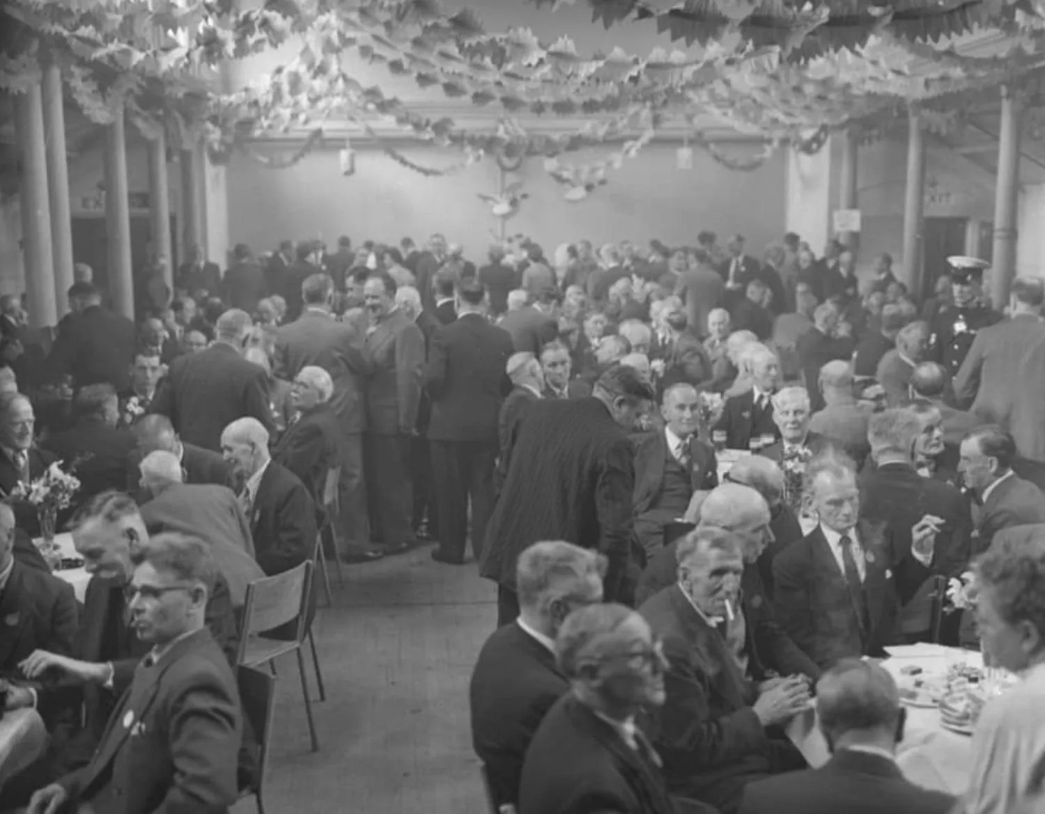 Archive photo showing people congregating inside the building. By Office S&M, RIBA Chartered Architectural Practice in London.
