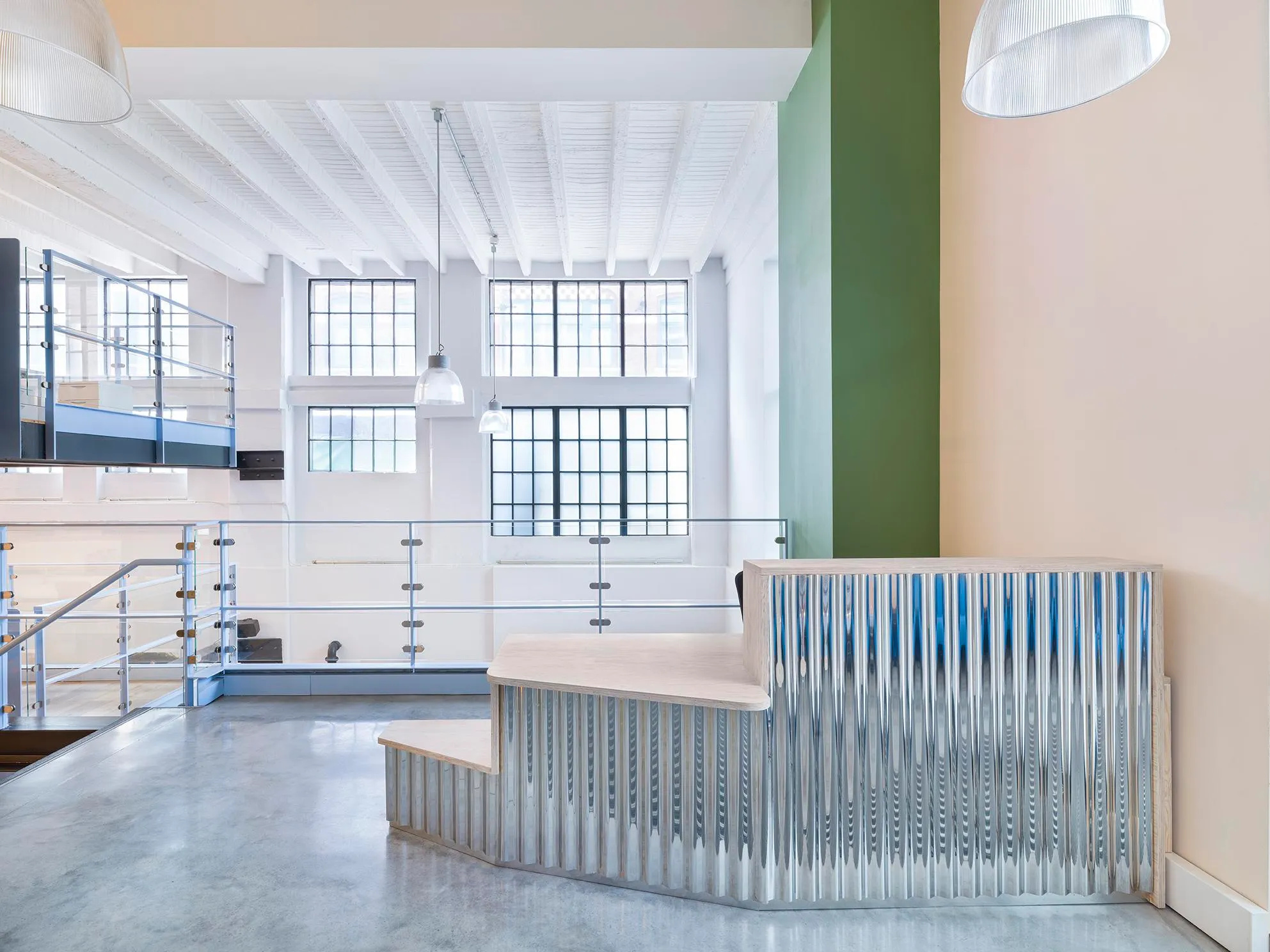 Photo of the reception area, with an open working space in the background. By Office S&M, RIBA Chartered Architectural Practice in London.