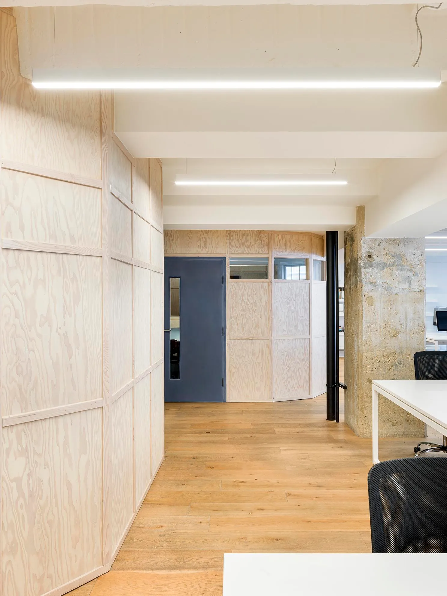 Photo of the corridor in warm materials. By Office S&M, RIBA Chartered Architectural Practice in London.