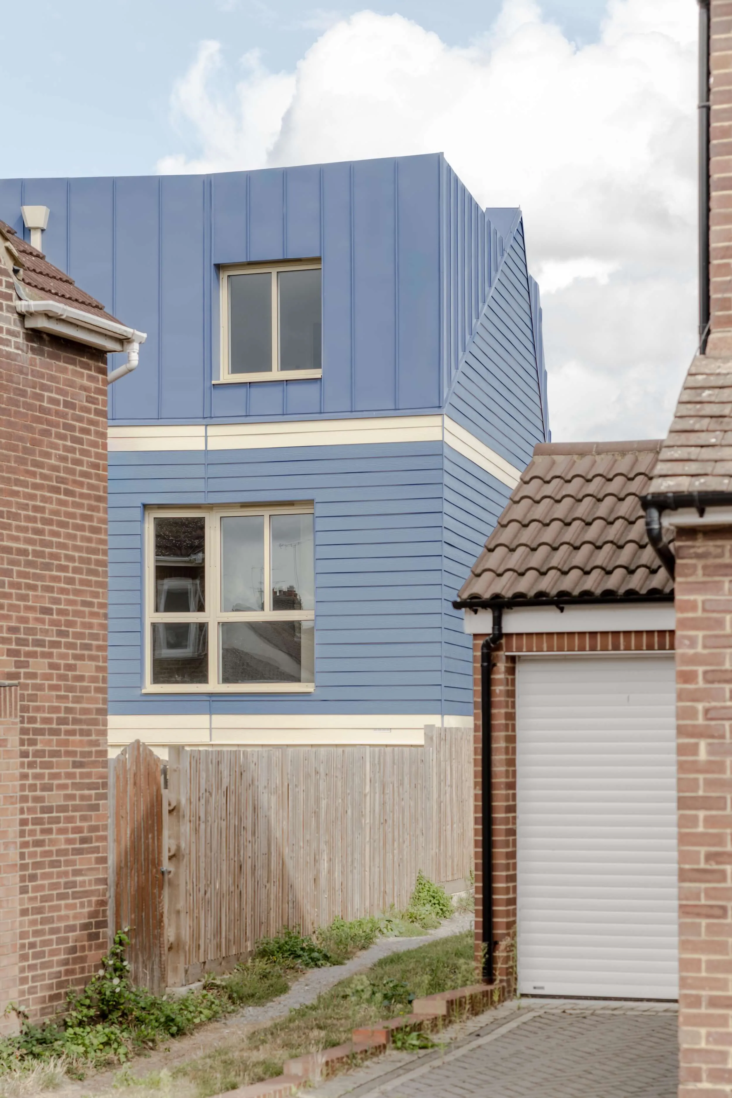 Photo of Goldsmith Mews project, looking at the building through the neighbouring properties. By Office S&M, RIBA Chartered Architectural Practice in London.