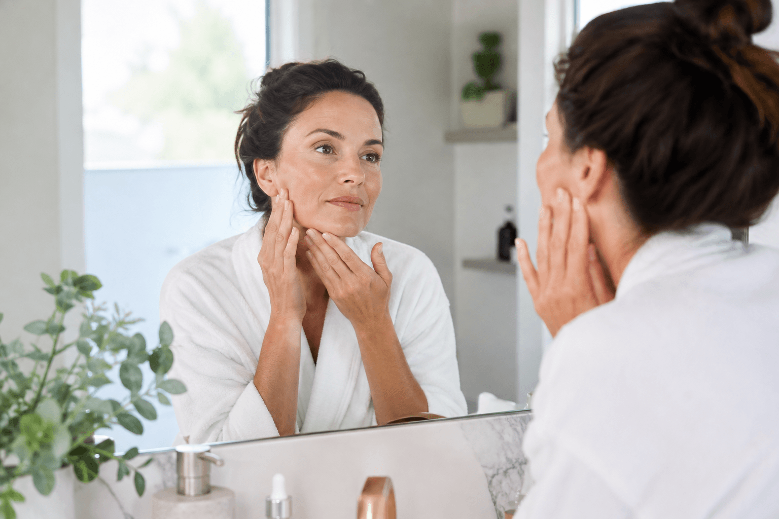 Provider performing a non-surgical skin tightening treatment on a client's face in Denver