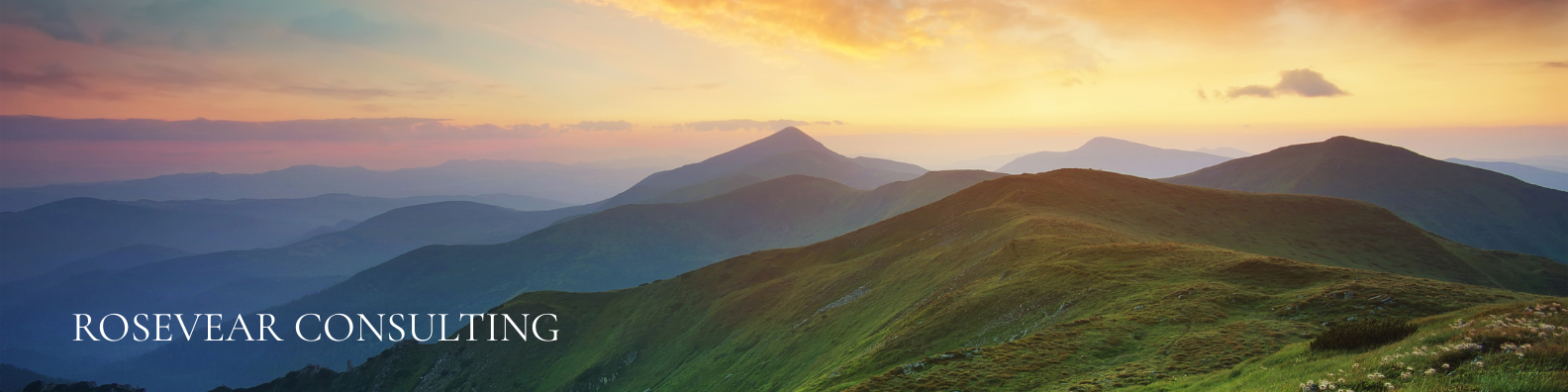 Mountain landscape backdrop with Rosevear Consulting logo, representing strategic consulting for luxury resorts, adventure destinations, and exclusive retreats.