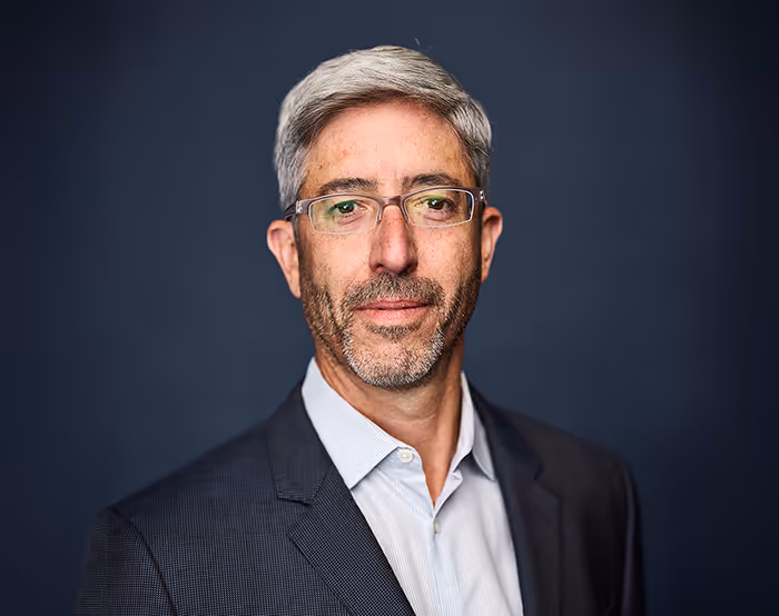 Professional portrait of Jordan Plawner, founder of Pacific AI Advisory.