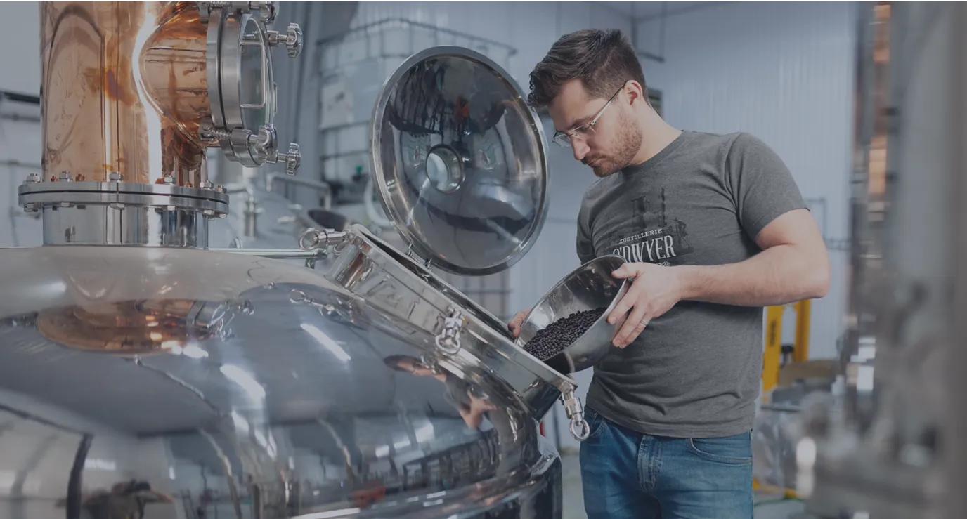A man standing in front of a machine.