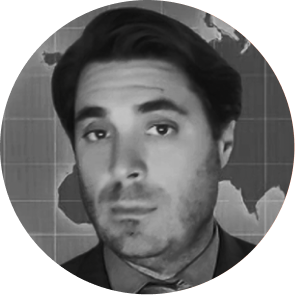 Black and white close-up portrait of a man with dark hair and a slight beard, wearing a collared shirt and tie, with a world map background.