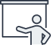 Icon of a person standing and pointing at a blank presentation board.