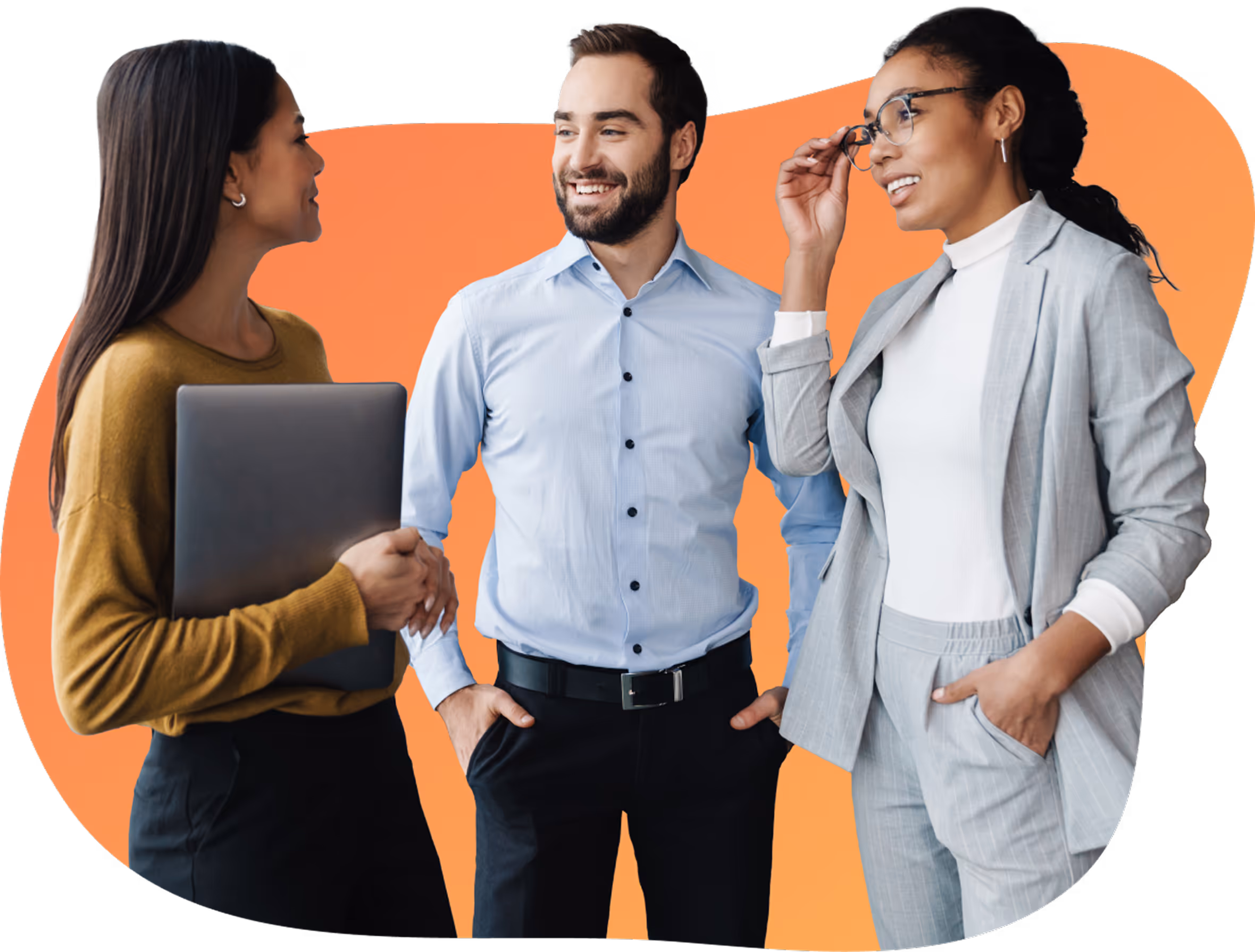 Three diverse business professionals standing and smiling, with a woman holding a laptop and another adjusting her glasses.
