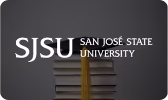 Stack of closed books with the San José State University logo above on a dark background.