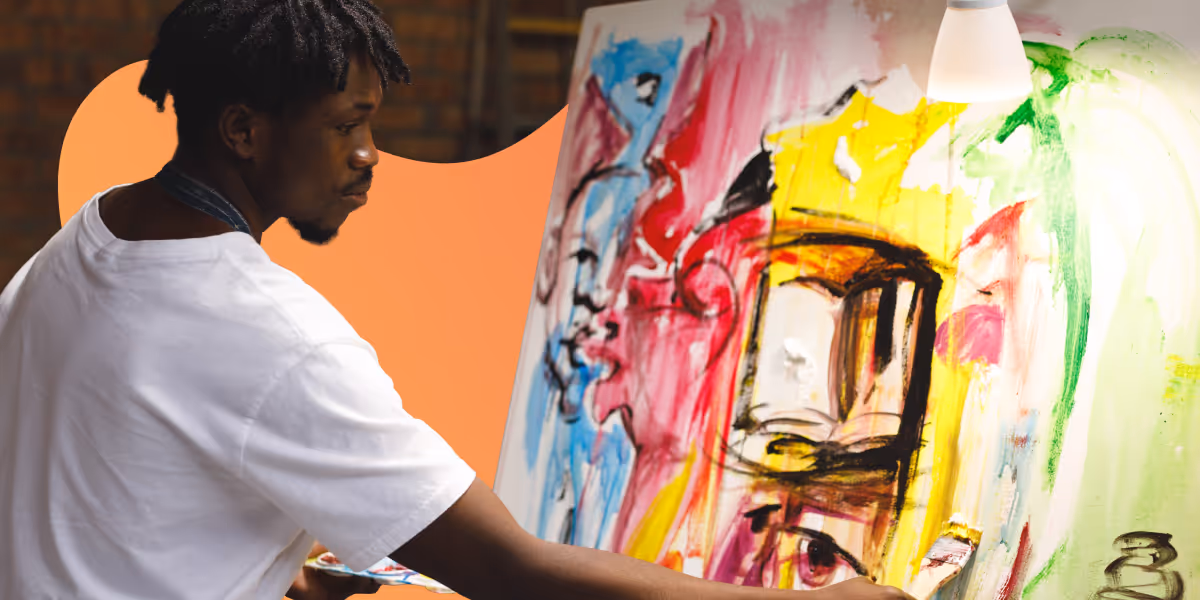 Artist in a white shirt painting a colorful abstract portrait on a large canvas.