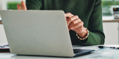 Person working on a laptop at a desk