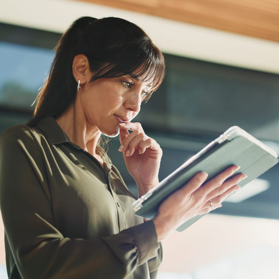 Woman reviewing program details on a tablet
