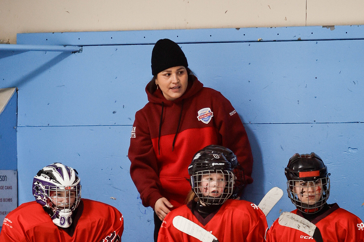 Olympian Brigette Lacquette shares advice with young female hockey players while coaching at the 2026 Manitoba Winter Games.