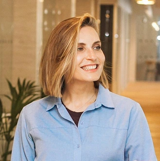 A woman in a blue shirt at the office