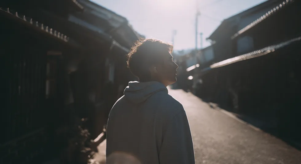 Crowded street with a person visible at the center through the blur