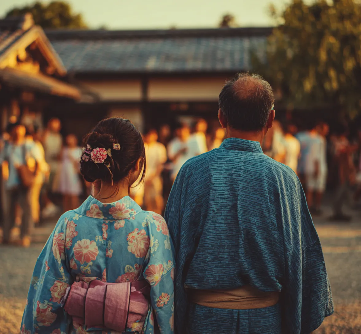 Two people in traditional clothing standing together at a festival.