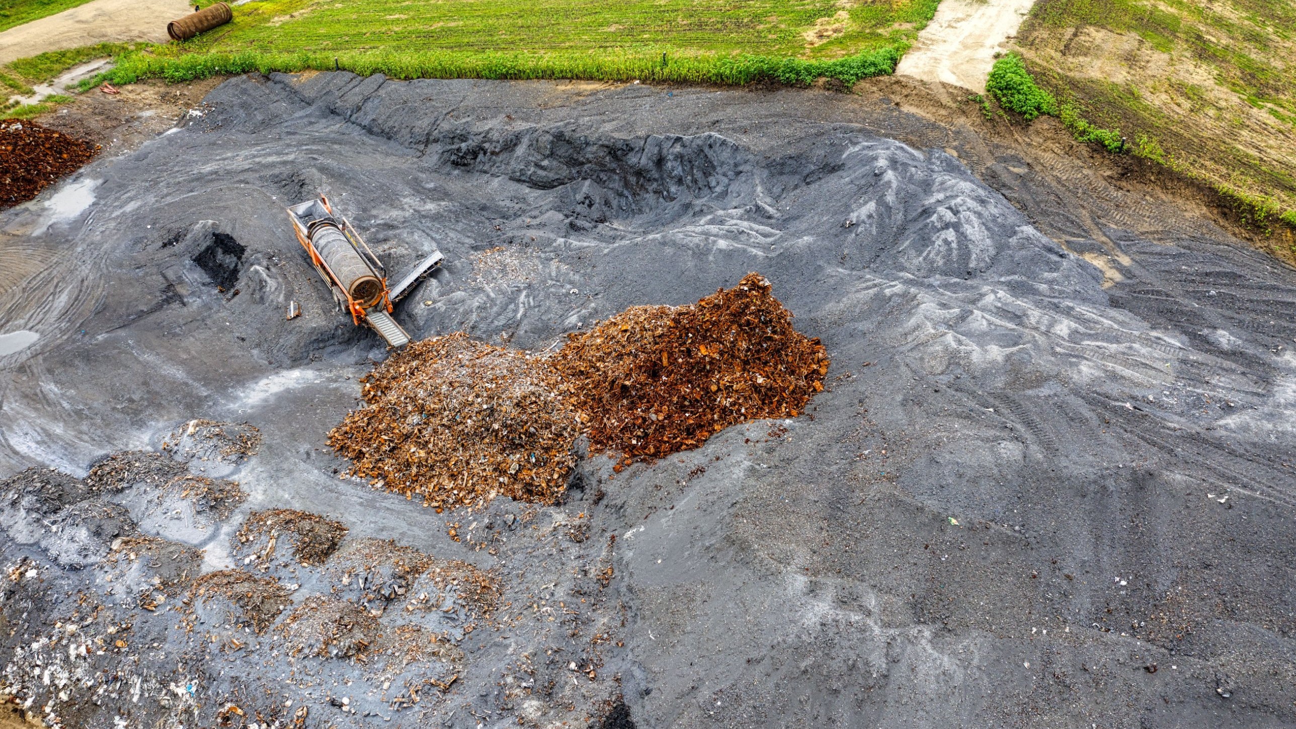 Trash poured into active landfill