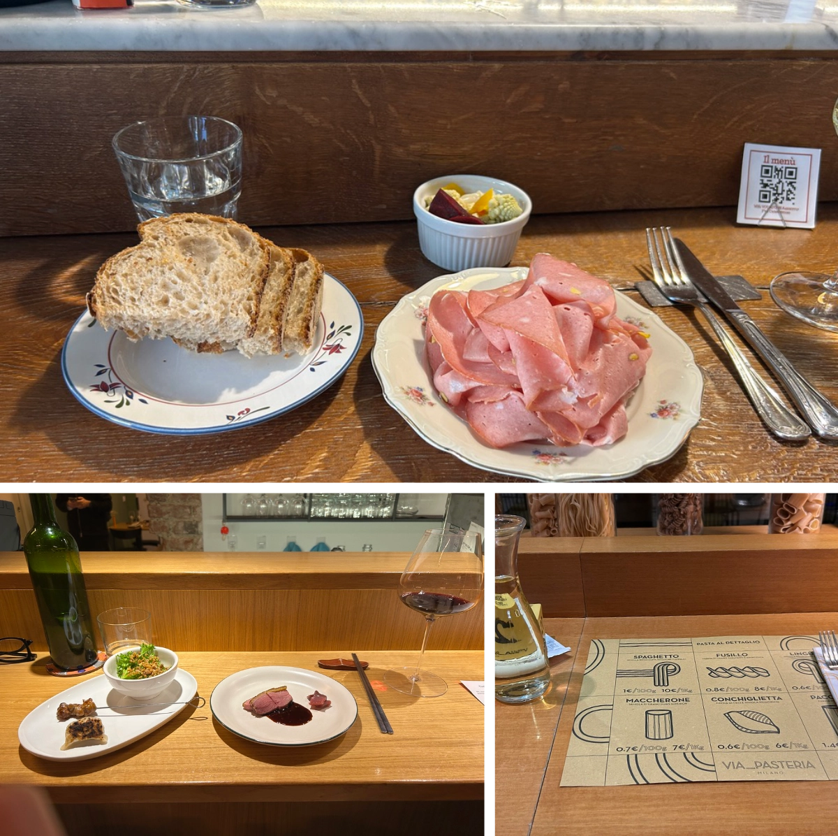 Bar counter set for one with bread, sliced cured meat, small dishes, wine, and a paper menu on a wooden surface.