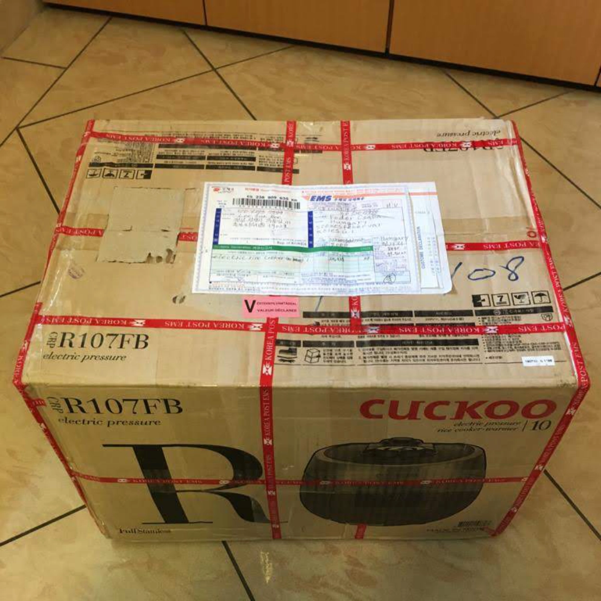 Cuckoo electric rice cooker in a shipping box