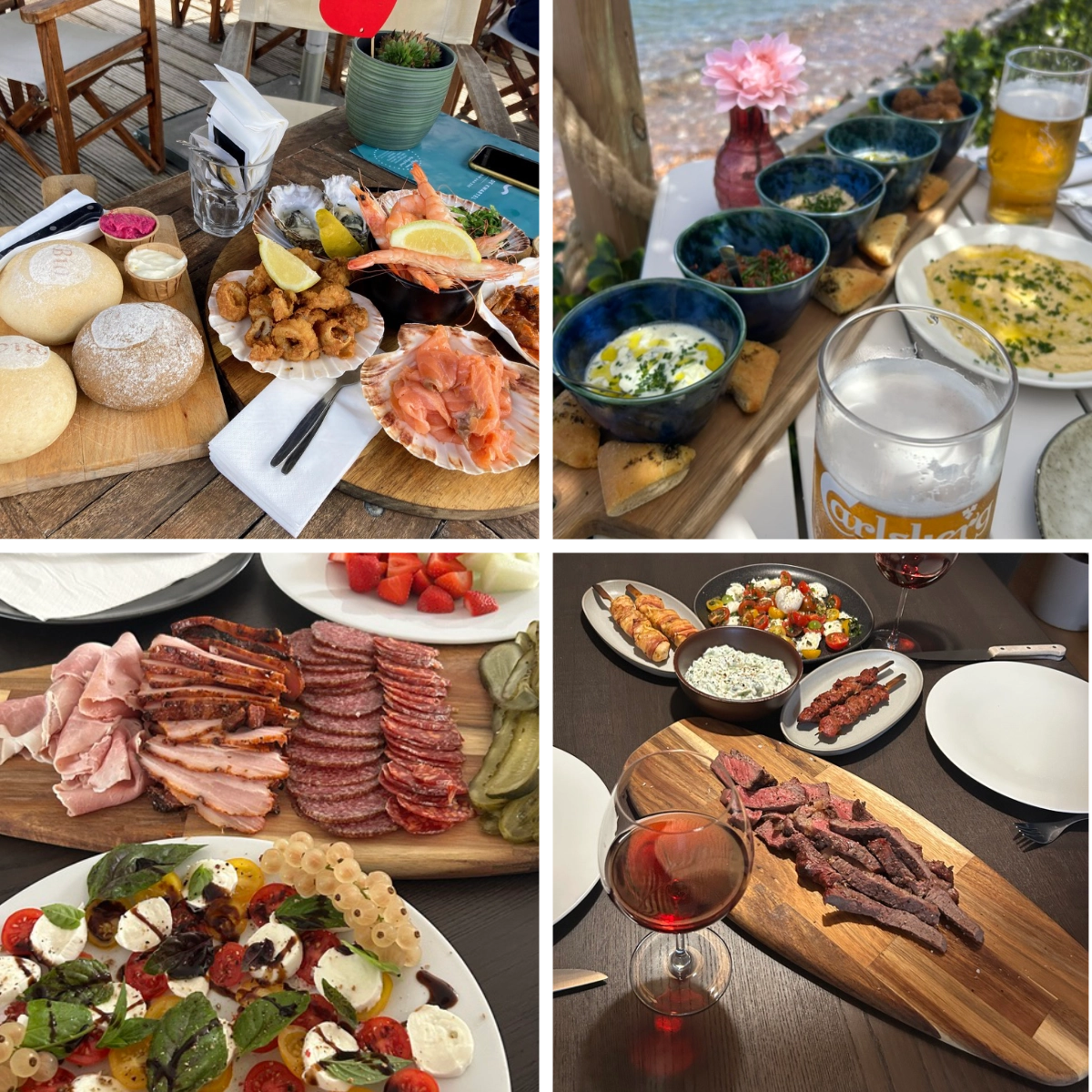 A table set with shared dishes including seafood, cured meats, bread, salads, and grilled meat, served with beer and wine.