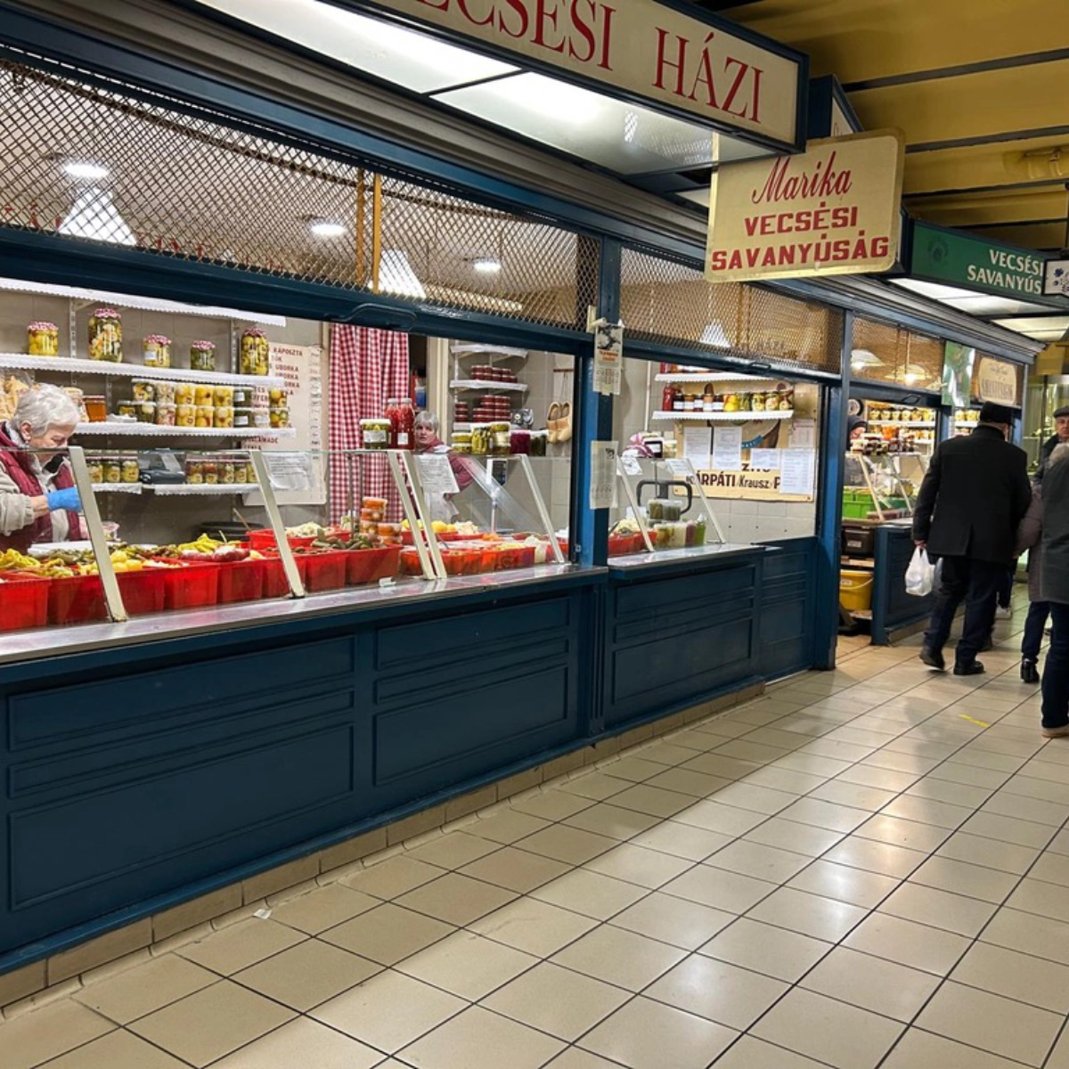 Market stall in Budapest selling jars and trays of Hungarian pickled vegetables (savanyúság).