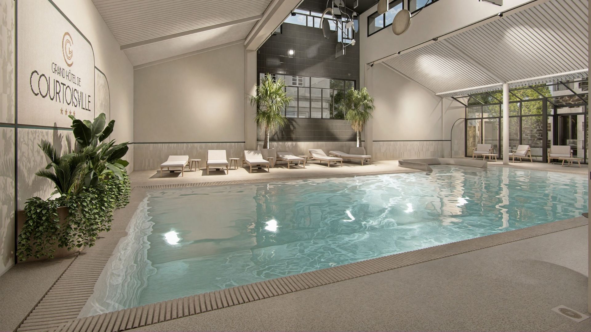 Heated indoor pool at the Grand Hotel de Courtoisville in Saint-Malo, a 4-star spa hotel in Brittany.