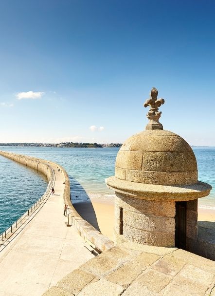 Seaside stroll near the Grand Hotel de Courtoisville in Saint-Malo, a luxury hotel near Sillon beach.