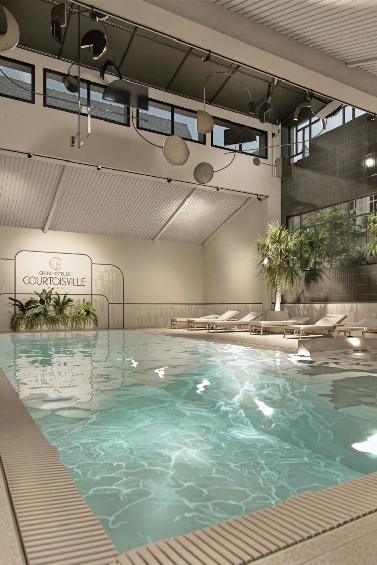 Heated indoor pool at the Grand Hotel de Courtoisville in Saint-Malo, 4-star spa hotel with jacuzzi and sauna.