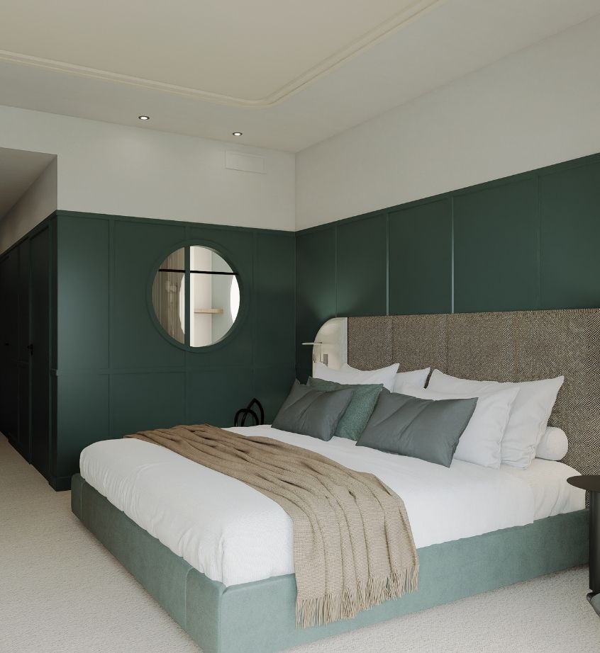 Lit confortable dans la Chambre Familiale du Grand Hôtel de Courtoisville pour des vacances en famille à Saint-Malo.