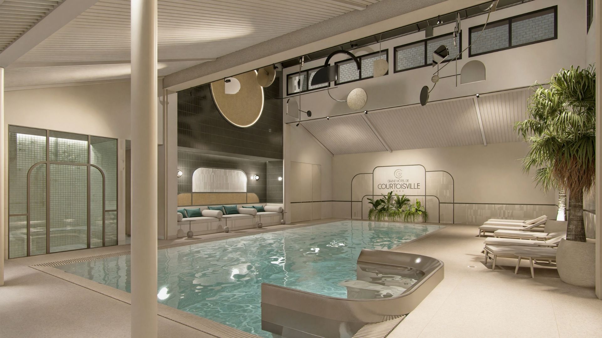 Heated indoor pool at the Grand Hotel de Courtoisville in Saint-Malo, 4-star spa hotel with jacuzzi and steam room.