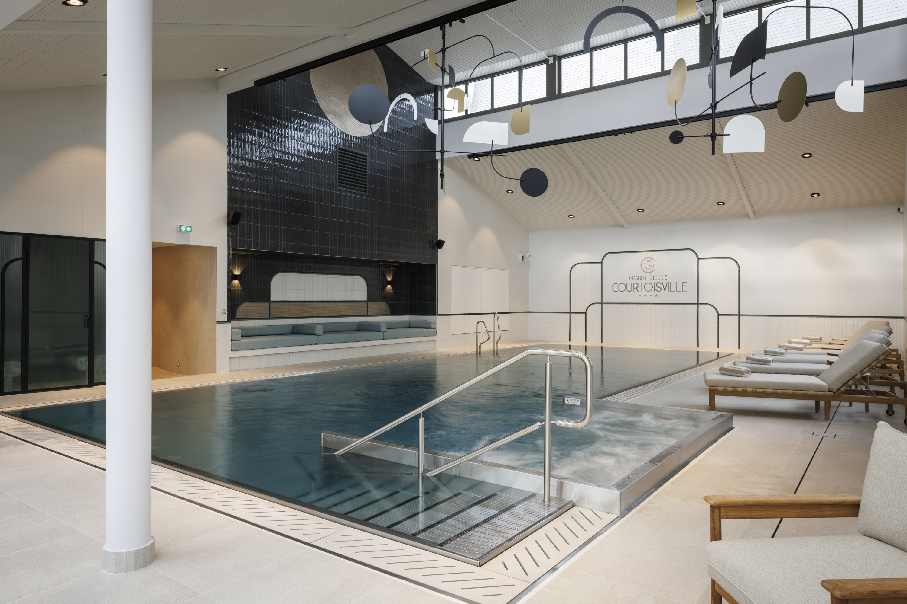 Heated indoor pool at the Grand Hotel de Courtoisville in Saint-Malo, a 4-star spa hotel in Brittany.