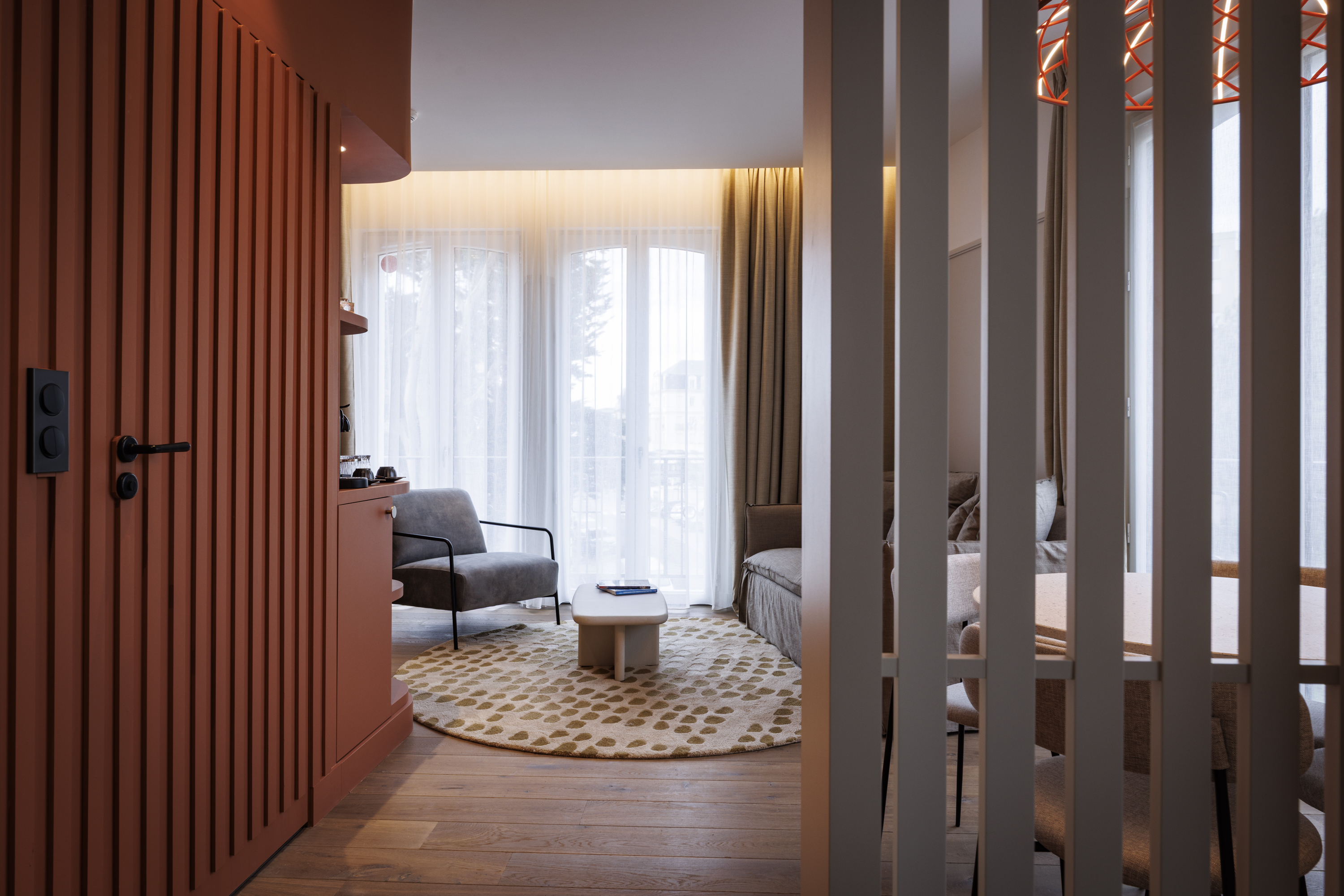 Lounge area with sofa and table in the Family Duplex Suite at the Grand Hotel de Courtoisville in Saint-Malo.