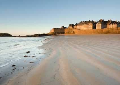Sunny landscape of the beach in front of the Grand Hôtel de Courtoisville on an Indian summer day in Saint-Malo.