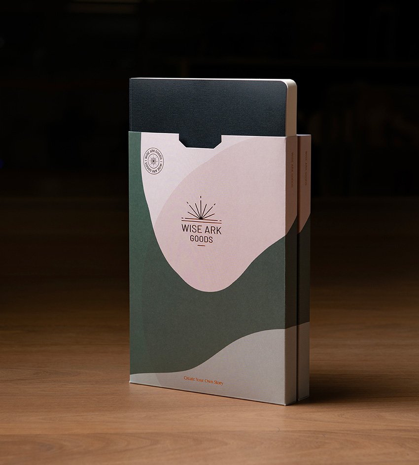 notebook on wooden tabletop popping out from sleeve