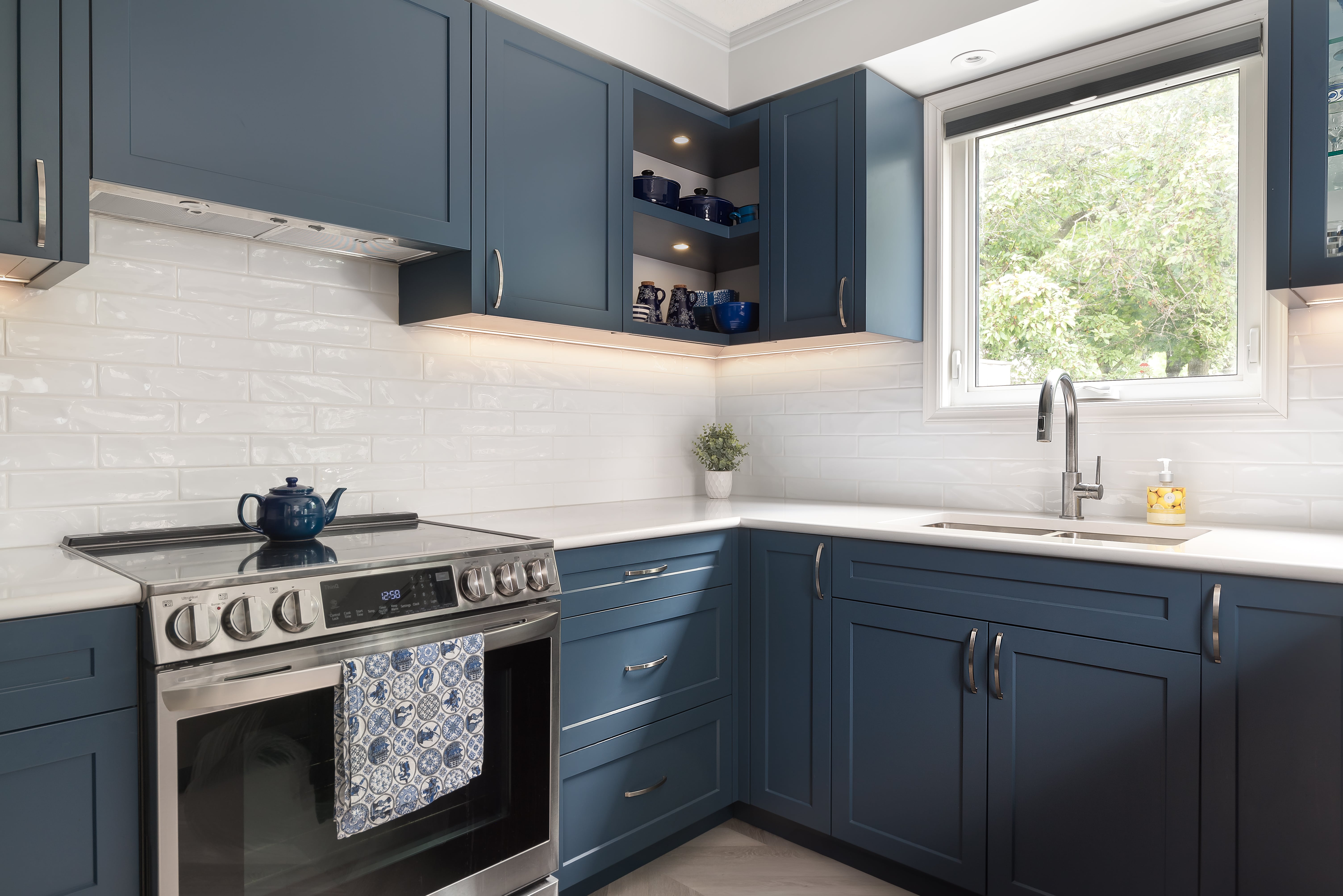 Custom kitchen island crafted by Goosen Inc. in Kitchener, Ontario, featuring premium cabinetry, elegant millwork, and integrated storage solutions in a contemporary home setting.