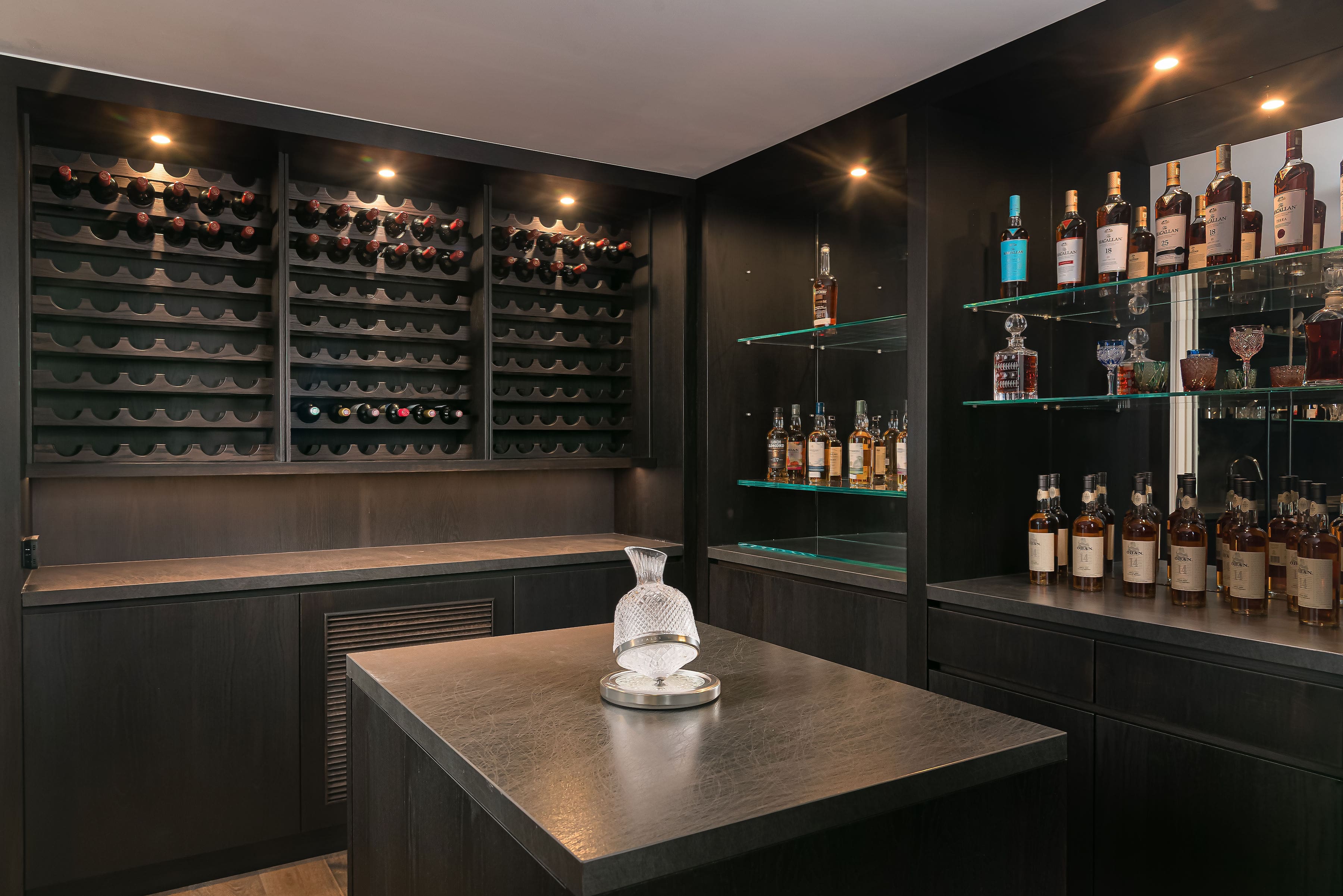 Bar area with custom cabinetry and millwork in a private Richmond Hill residence by Goosen Inc.