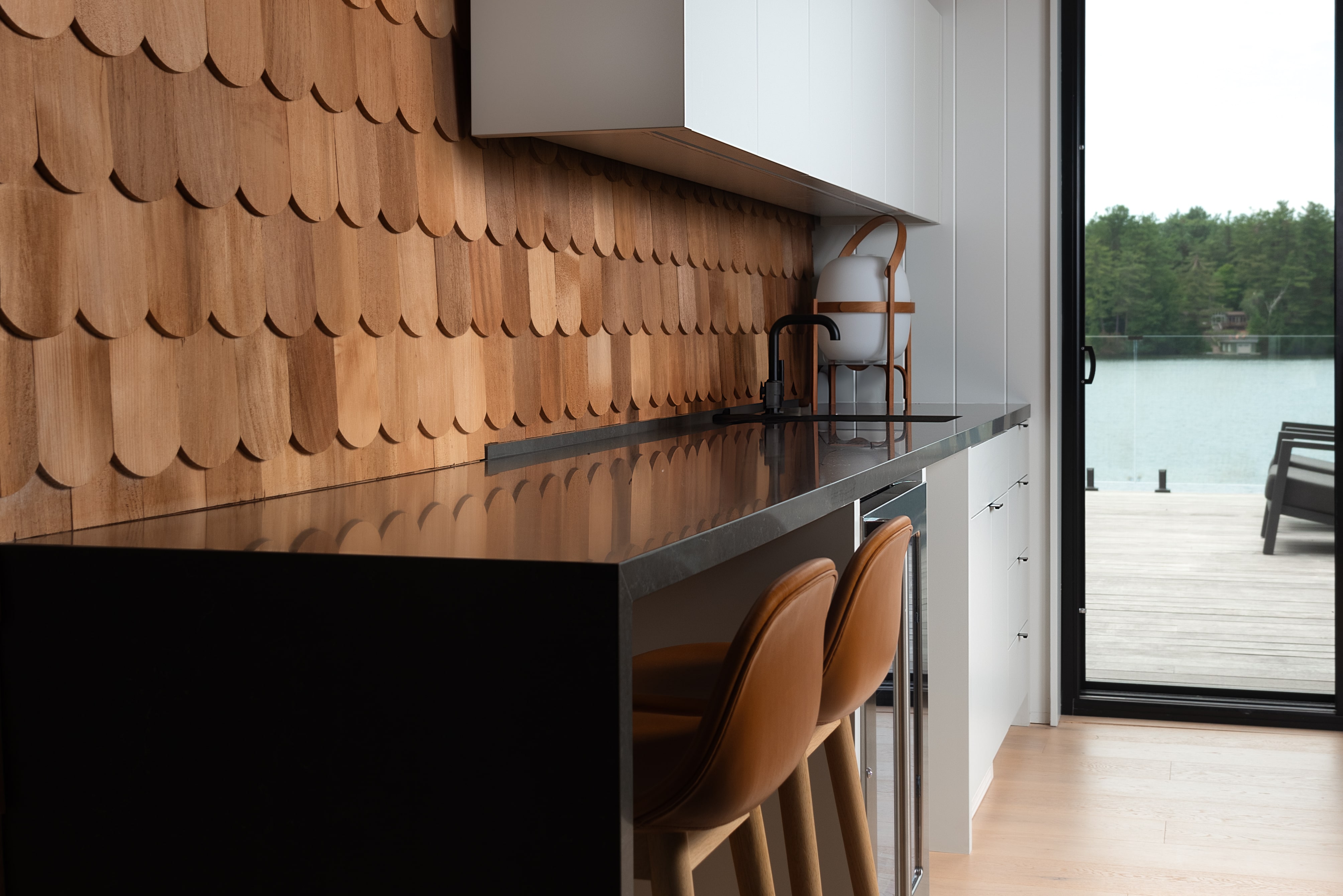 Interior view of the Acton Boathouse on Muskoka Lake, Ontario, featuring custom cabinetry and built-in millwork by Goosen Inc., designed for elegant and functional waterfront living.