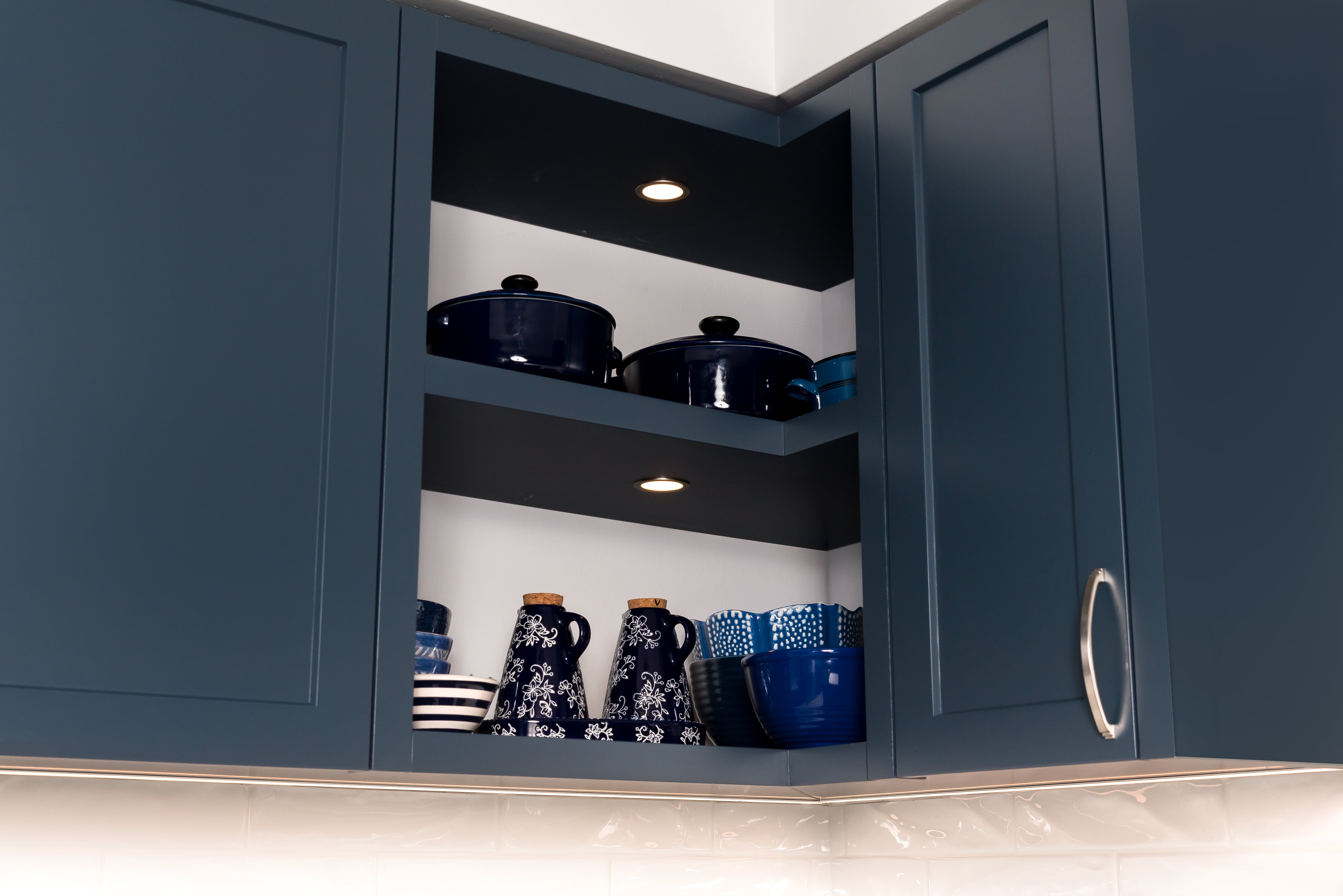 Close-up view of custom kitchen cabinetry by Goosen Inc. in Kitchener, Ontario, highlighting fine millwork, seamless drawer integration, and premium wood finishes in a modern residential kitchen.
