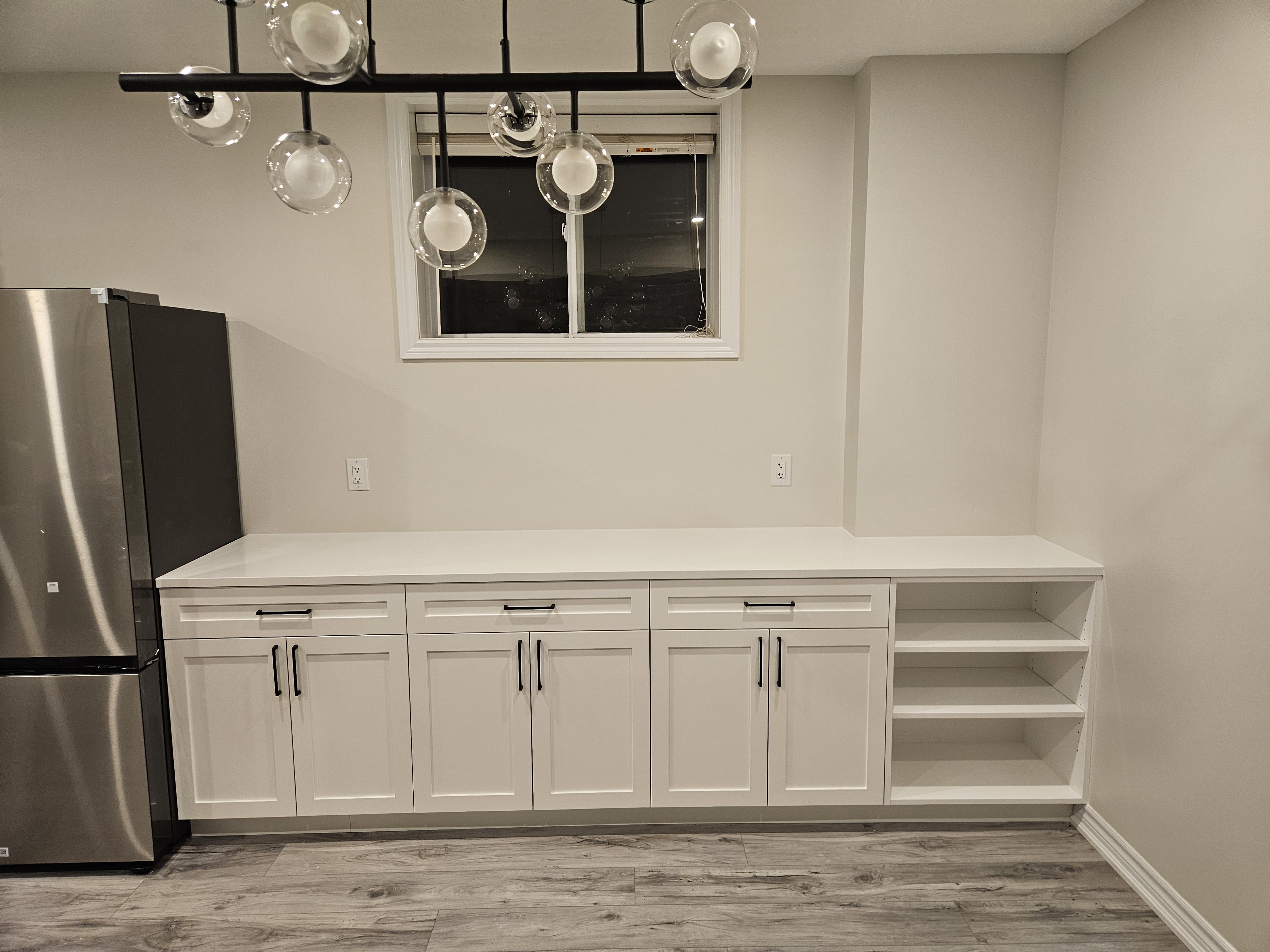 Close-up of custom drawer cabinetry in a Cambridge, Ontario basement project by Goosen Inc.