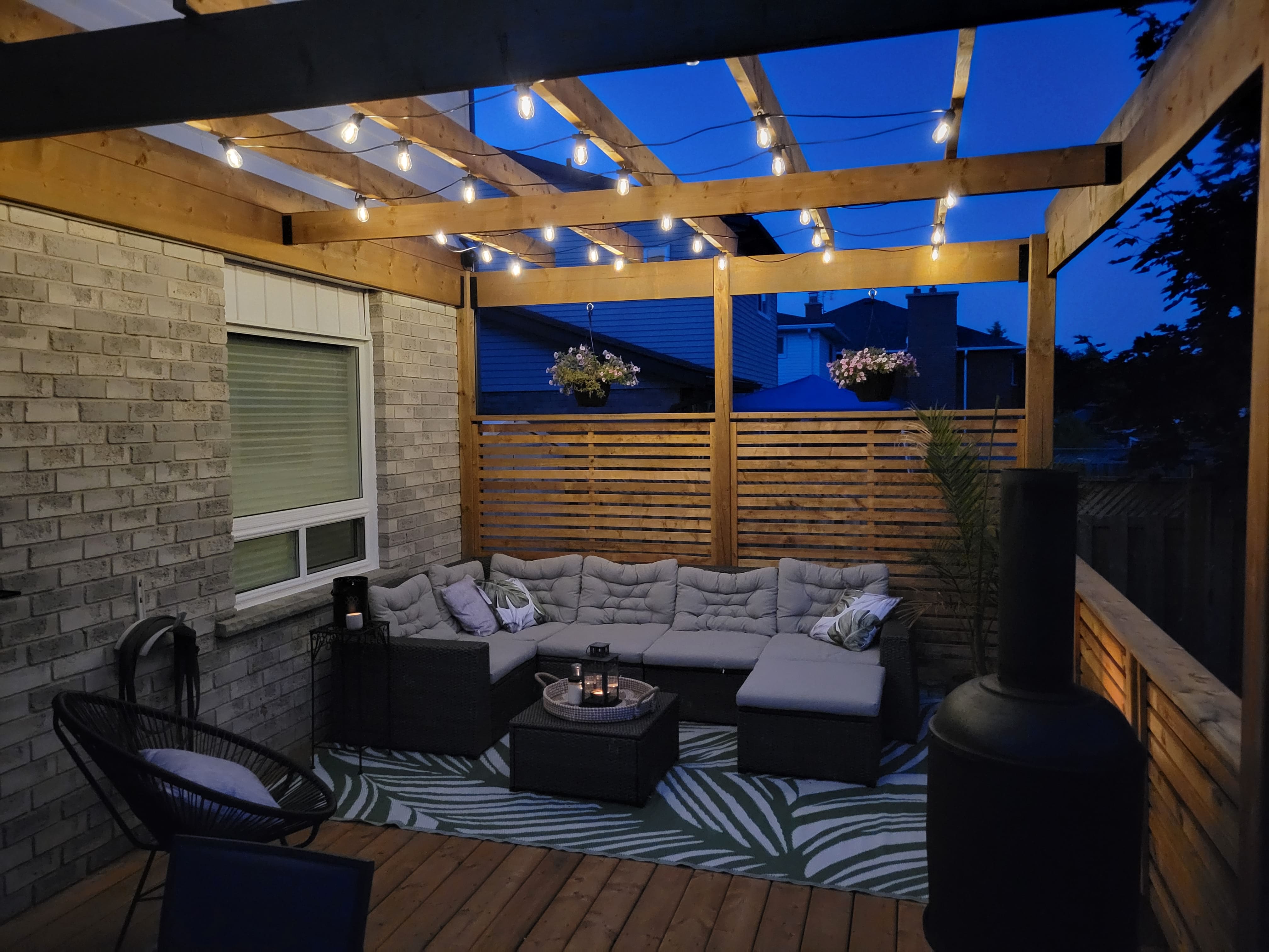 Custom outdoor deck with wood railing and spacious design in a Waterloo, Ontario project by Goosen Inc.