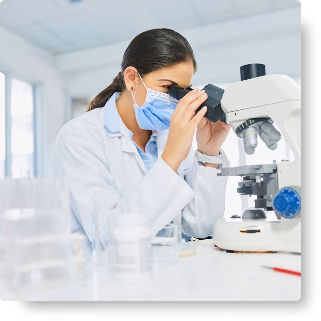 girl using microscope