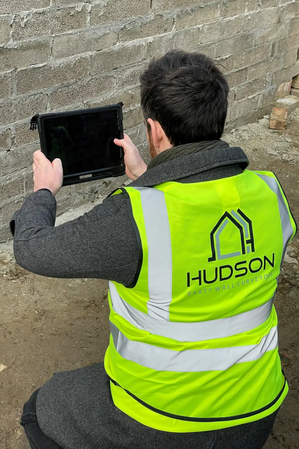 Party Wall Awards Hudson surveyor taking a picture 