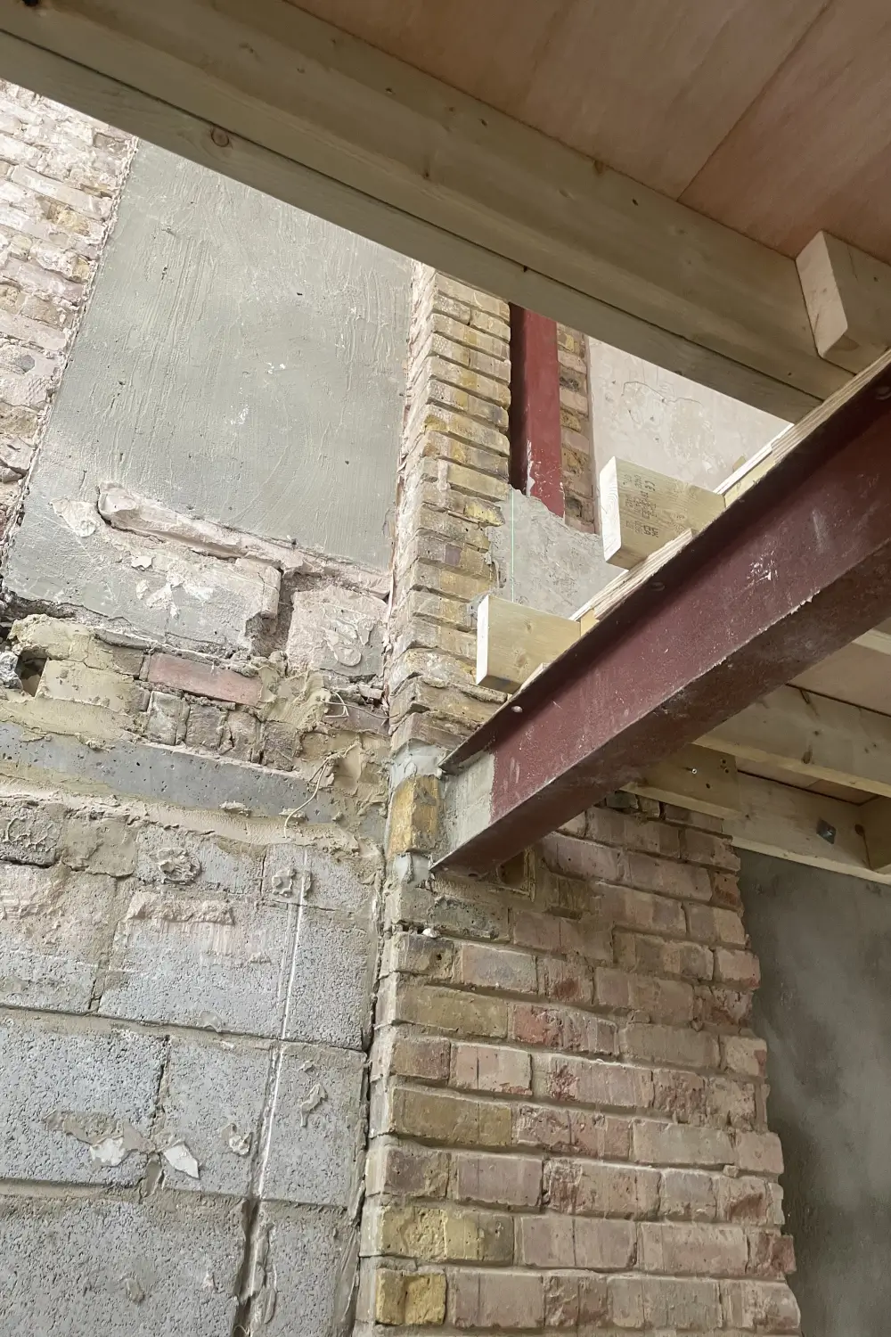 Exposed Party Wall inside property with steel beam