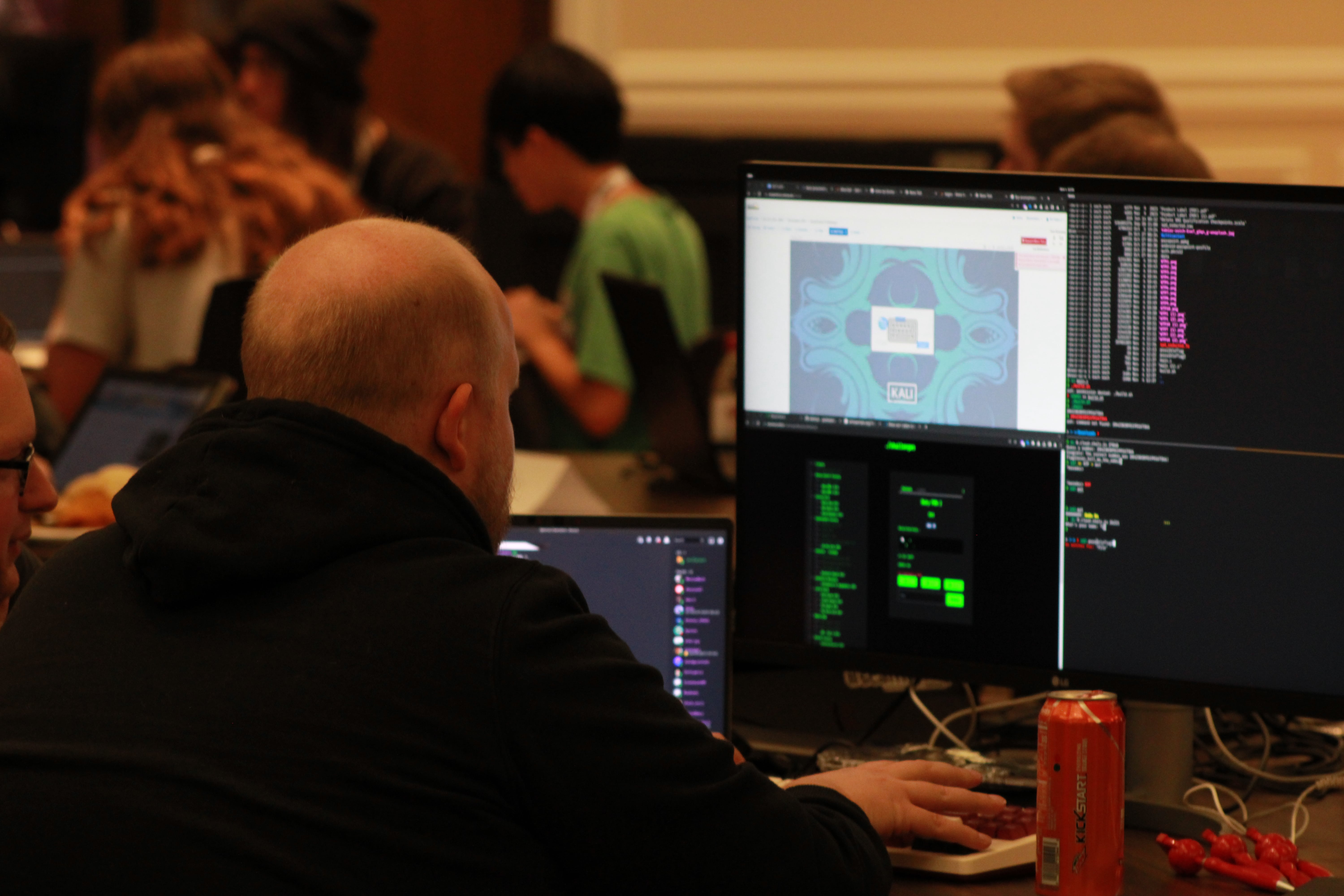 A man doing cybersecurity challenges on a computer.